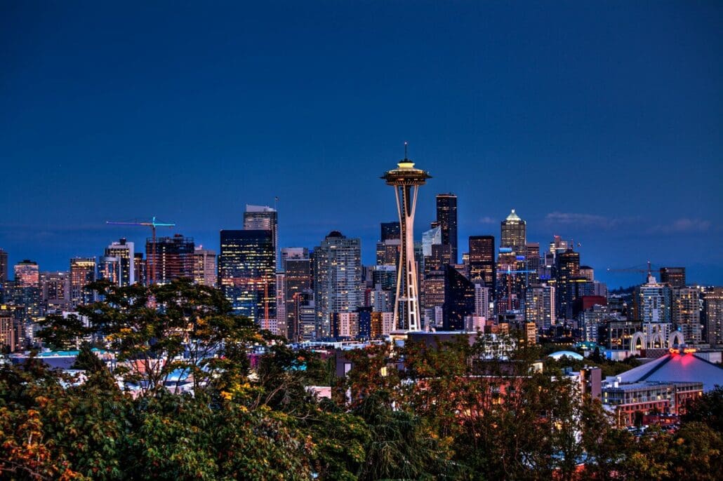 aerial photography of Seattle skyline and iconic Space Needle. Join a club in seattle to start feeling at home.