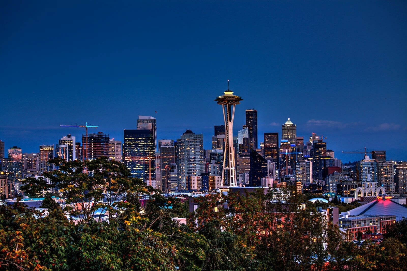 aerial photography of Seattle skyline and iconic Space Needle. Join a club in seattle to start feeling at home.