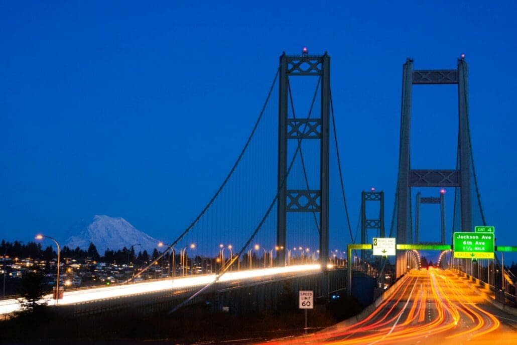 The Tacoma Narrows bridge with lights at night. Happy Halloween
